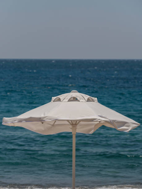 white umbrella and peaceful sea view