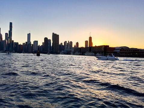 Chicago skyline at sunset from lake Michigan during a cloudless day