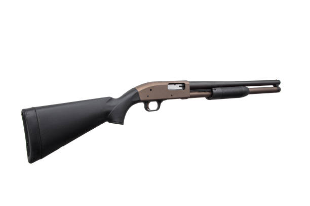 istock Pump-action 12 gauge shotgun isolated on a white background. A smooth-bore weapon with a plastic stock. 1410535948
