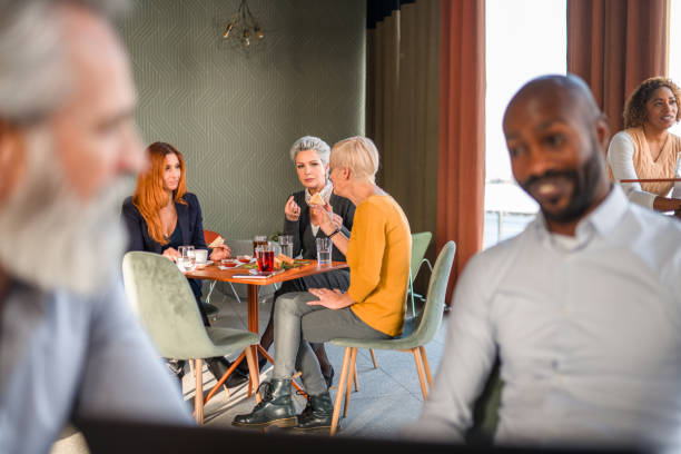 istock Business Partners Having A Meeting In A Cafeteria 1410537120