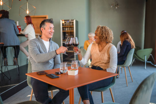 istock Business Coworkers Toasting With Wine At Cafe 1410537135