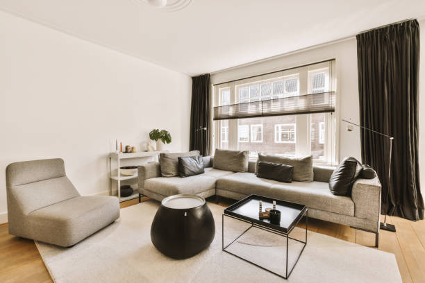 istock Bright spacious living room with a large sofa 1410537527