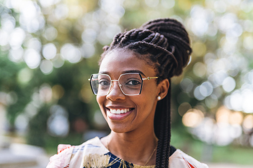 Portrait of a smiling woman in the public park