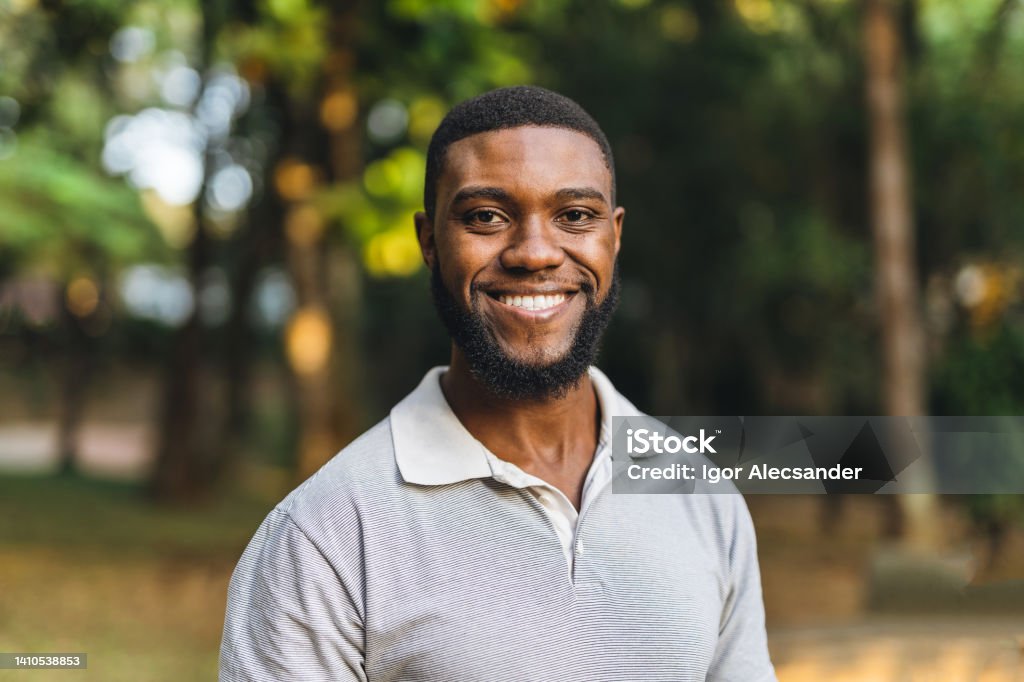 Young man in the public park Young african american man in public park People Stock Photo