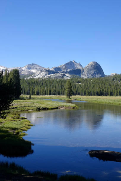 istock Snow capped mountains reflecting in the water 1410539500