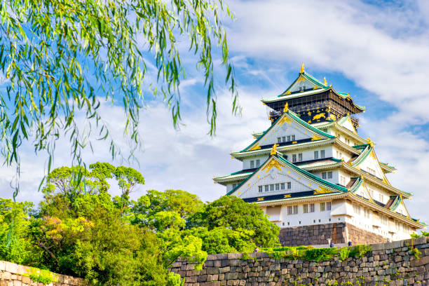 Osaka Castle in Summer, Osaka, Japan Japan - July 19, 2019 : Scenic view of Osaka Castle surrounding with small moat in Summer, Osaka Castle Park, Osaka osaka prefecture stock pictures, royalty-free photos & images