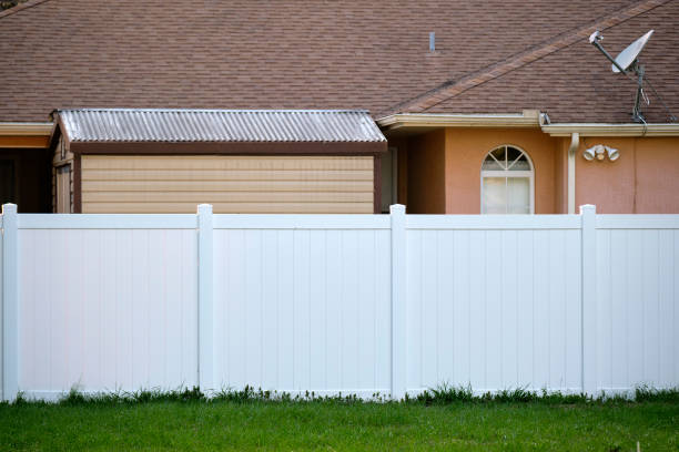 White plastic fence for back yard protection and privacy White plastic fence for back yard protection and privacy. fence stock pictures, royalty-free photos & images