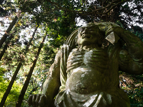 Kunisaki, Japan - October 30, 2016: Stone guardian statue at Futagoji Buddhist temple on Kunisaki peninsula