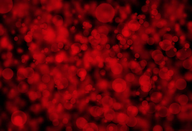 Abstract background in red tones with defocused bokeh light and dynamic glowing lines.