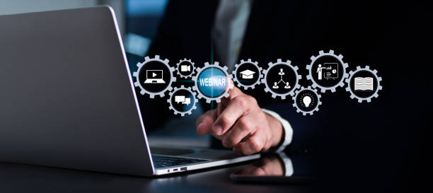 istock The notion e-learning. Webinars used for online education, conferences, courses,gatherings, among other things.person push button to join, enter, or see live broadcast.Online communication technology. 1410552415