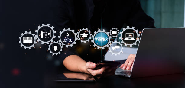 istock The notion of e-learning. Online education, conference, course, and meeting through webinar. A person touches a button to join, enter, or view a live broadcast. Web-based communication technology. 1410552500