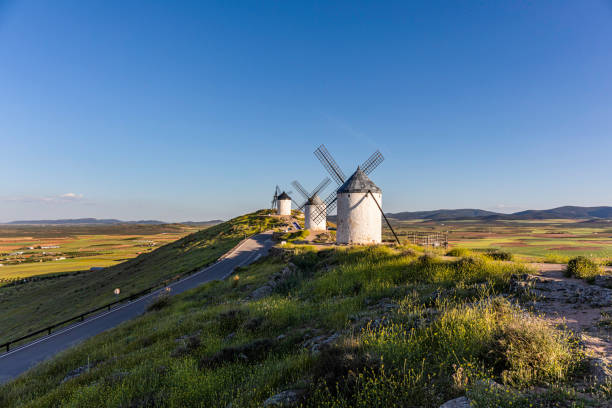 istock Historic whitewashed windmills and a 12th-century castle on a hill above Consuegra located in the province of Toledo, Castilla-La Mancha, Spain 1410556091