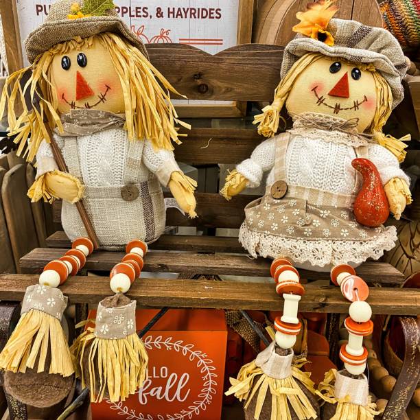 istock Male and Female Stuffed Scarecrow Fall Decorations 1410557293