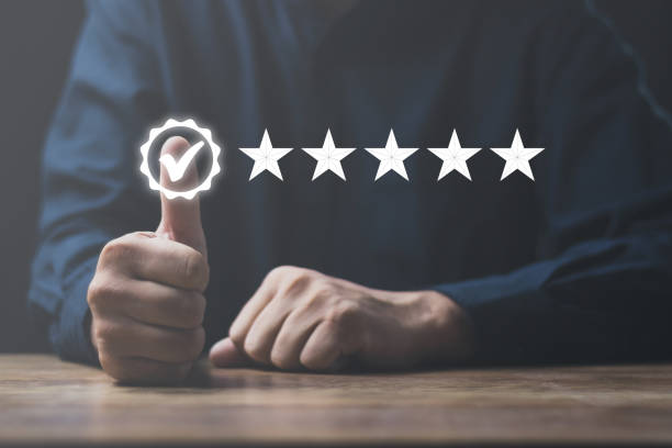 istock Customer service and Satisfaction concept Men's hands doing online assessments in the satisfaction rating the popular service company allows customers in order to improve and develop the organization 1410558087