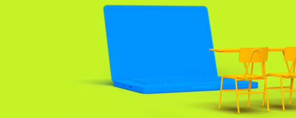 istock School desks in front of blue laptop, side view 1410565430