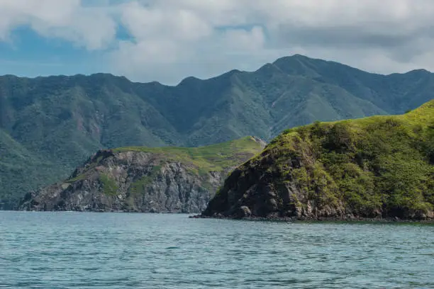 the green and rocky coast of the Murcielago Island in Costa Rica