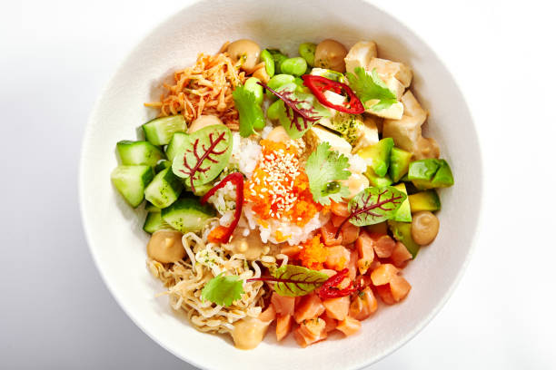 istock Poke with salmon, cut avocado and tofu side view 1410568026