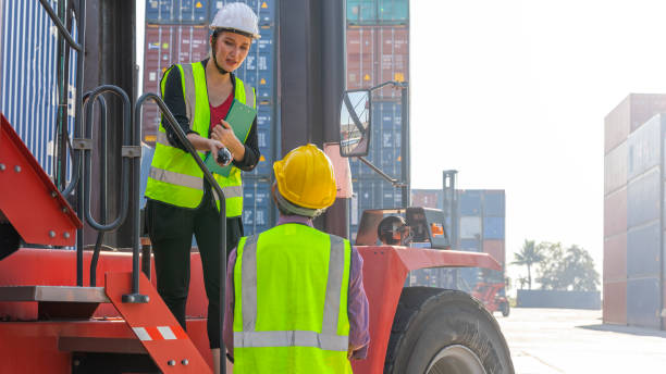 istock Two generations with business partnership at container 1410568423