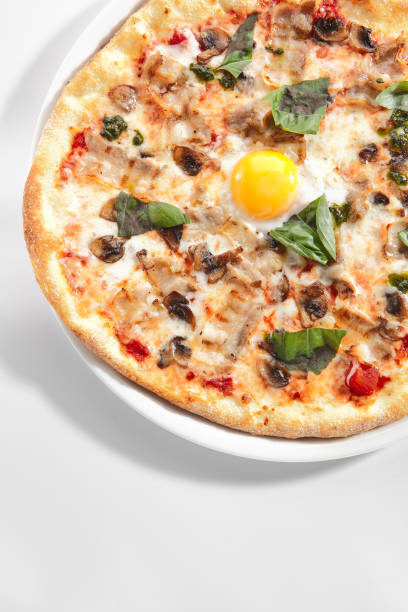 istock Pizza with Mushrooms, Bacon and Egg in Restaurant Plate Isolated 1410569099