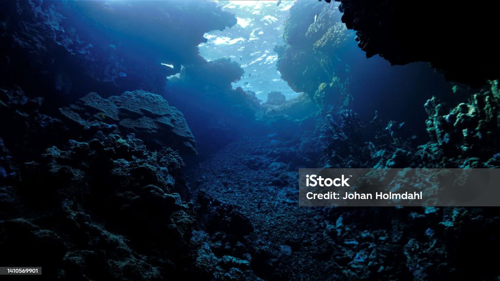 Rays of lights in caves and tunnels Underwater photography from a scuba dive Underwater Stock Photo