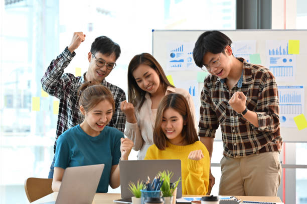 istock Young Asian businesspeople sharing an accomplish for interesting new target customer group in social media. Businness and Technology using concepts. 1410572854