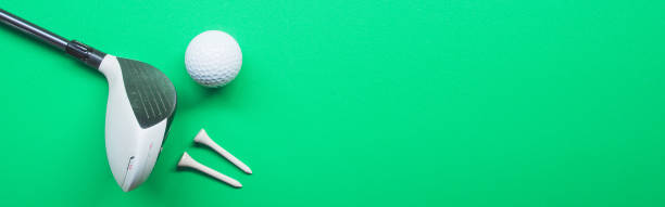 istock Golf equipment flat lay on green background. Top view. web banner size. 1410573087