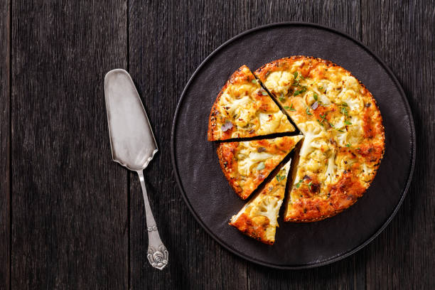 istock Cauliflower Cake with cheese, basil, top view 1410573778