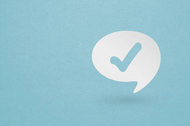 Paper cut Check mark in bubble speech icon isolated on grunge blue background. Choice button sign. Checkmark symbol. Speech bubble icon. Paper art style