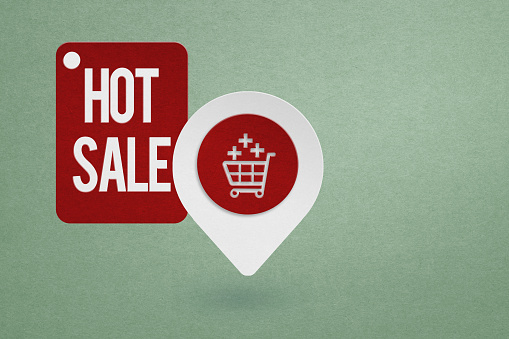 shopping cart icon with hot sales on tag red paper cut including copy space for business, marketing promotion concept