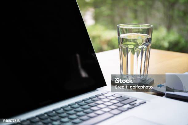 Office Table And Drinking Water In Glass Stock Photo - Download Image Now - Water, Drinking, Drinking Glass