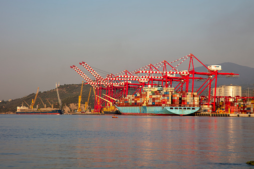Turkey - July 22 ,2022 :Large container ship in a dock at port, Gemlik, Bursa.