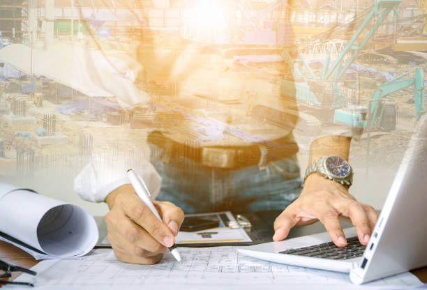 istock Double Exposure Future building engineering concept with exposure to graphic design. Building architects, engineers design industrial building construction with modern civil equipment technology. 1410579783