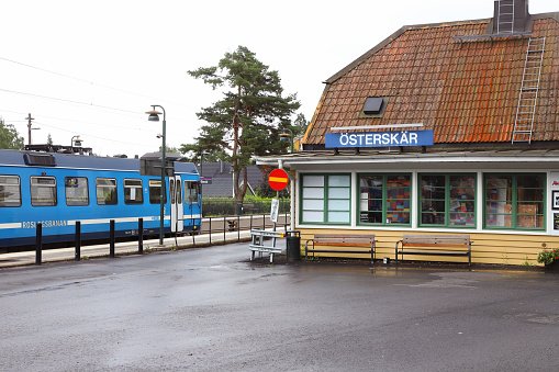 Osterskar, Sweden - August 16, 2021: The Roslagsbanan narrow gauge,light rail in service for SL at the Osterskar terminus station.