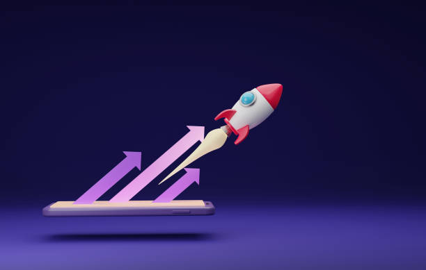 istock Rocket launched through a smartphone pointing up arrow on a dark purple background. 1410580631