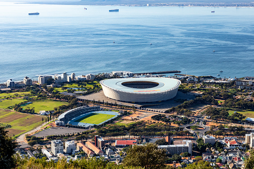 Cape Town, South Africa - June 29 2022: Aerial view of Cape Town Stadium and the Green Point Athletics track in Green Point. World Cup 2010