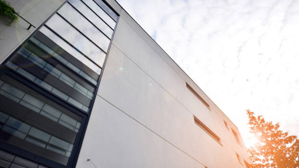 istock Architecture details. Modern glass building facade in sunny day. 1410584072
