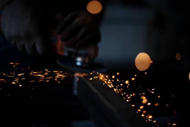 istock Sparks from the Bulgarian. Metal processing. Steel cutting workshop. 1410586113