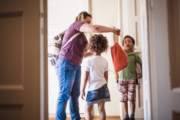 istock Mother taking her kids to school 1410587524