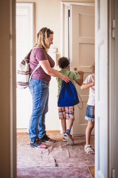 istock Mother taking her kids to school 1410587559