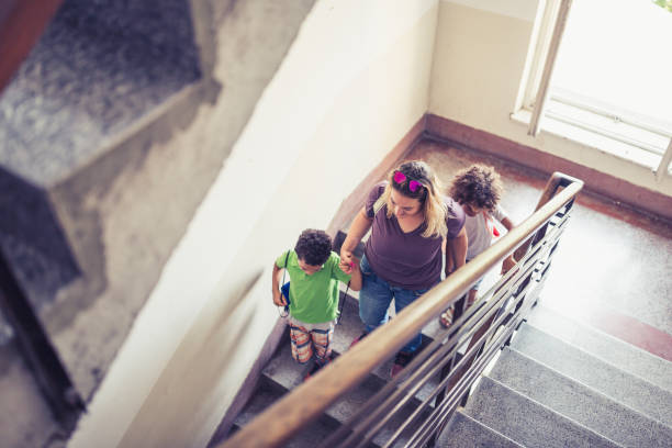 istock Mother taking her kids to school 1410587575