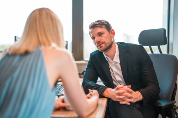 istock Handsome Businessman And CEO Talking With A Female Client 1410588831
