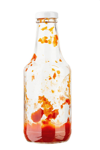 Open bottle of ketchup on isolated with white background. File contains clipping path. Open bottle of ketchup on isolated with white background. File contains clipping path. Full depth of field. ketchup-splash stock pictures, royalty-free photos & images