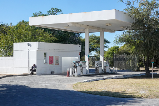 A petrol station attendant visible near Namutoni Gas Station at Etosha National Park in Khomas Region, Namibia