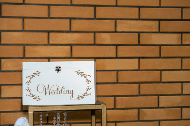 White box for wedding gifts on a background of red brick wall stock photo