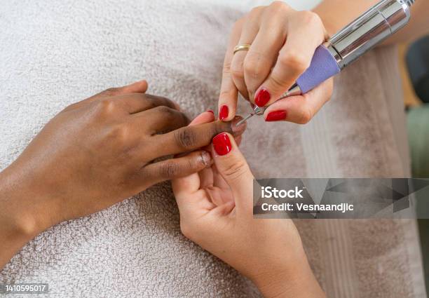 Close Up Of Female Hands Having Manicure Treatment Stock Photo - Download Image Now