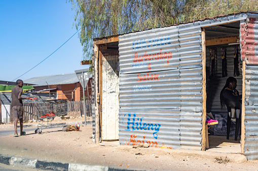 People visible near Barber Shop and Hair Salon at Katutura Township near Windhoek at Khomas Region, Namibia