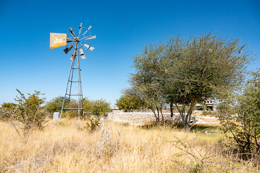 Water Pump at Etosha Trading Post on C38 Road in Kunene Region, Namibia. Identifiable information is visible near its blade.