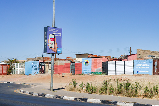 Katutura Township near Windhoek at Khomas Region, Namibia, with commercial signs visible.