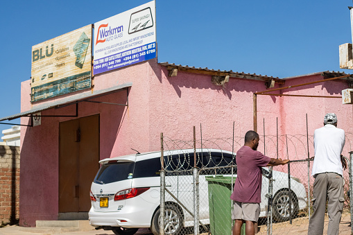 Retail Place in Katutura Township near Windhoek at Khomas Region, Namibia, with people and commercial signs visible.