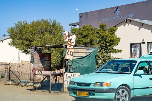 A butcher's stand and a car with number plates visible outside Eitaalo Medical Centre on Boitumelo Street at Katutura Township near Windhoek in Khomas Region, Windhoek
